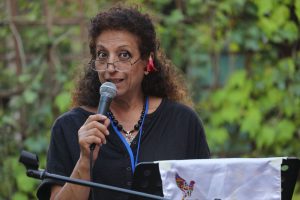 Rajaa Gharbi reading her poem at the Poets of the World meeting in Italy