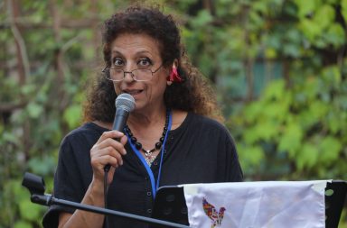 Rajaa Gharbi reading her poem at the Poets of the World meeting in Italy